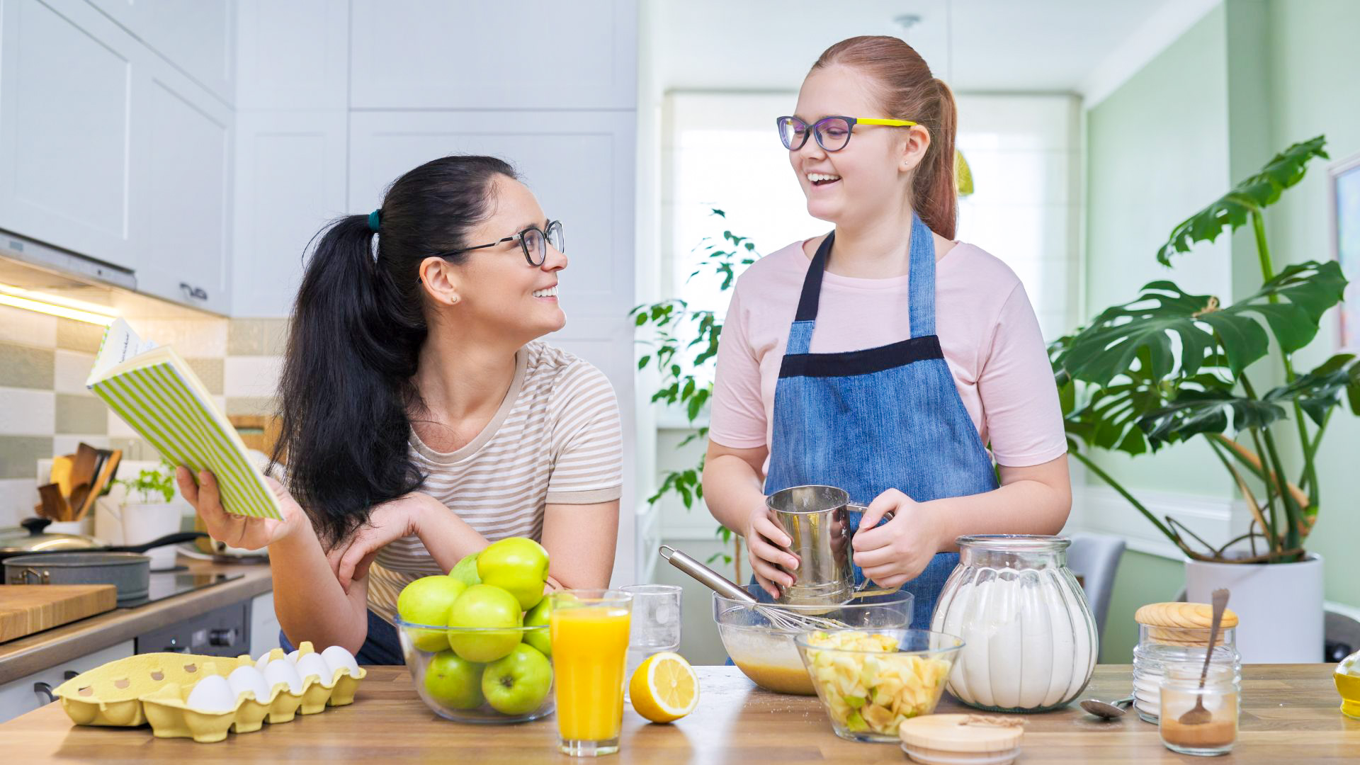Parent and teen cooking together